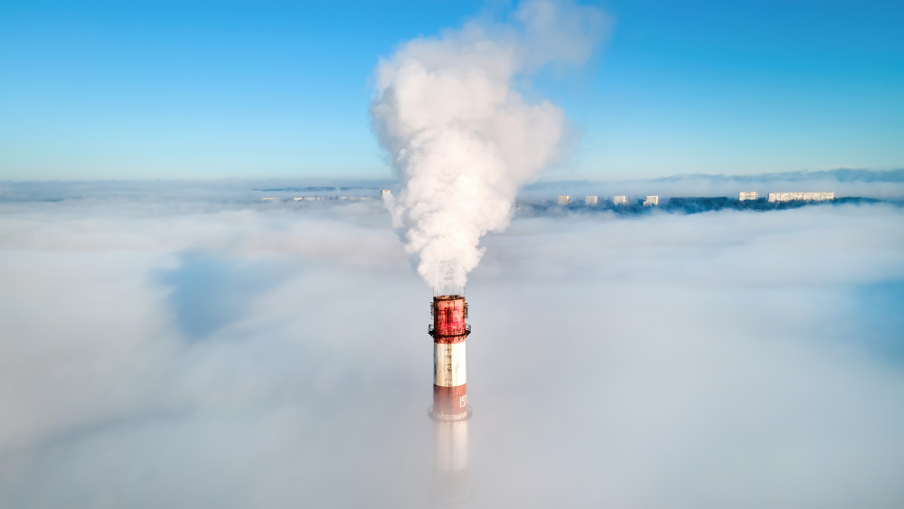 /upl/aerial-drone-view-of-thermal-station-s-tube-visible-above-the-clouds-with-smoke-coming-out_1.jpg