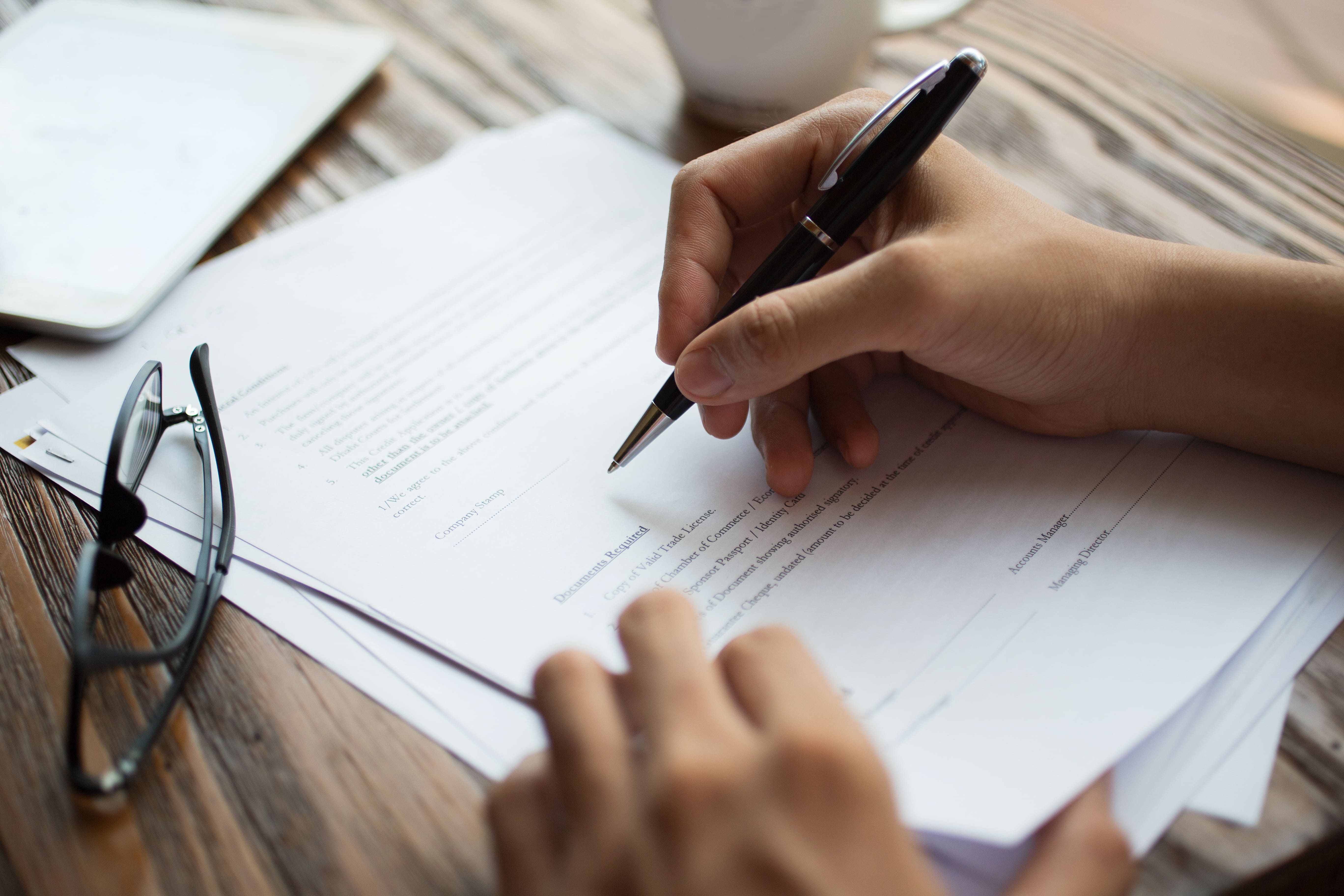 /upl/businessman-examining-papers-at-table%20(1).jpg