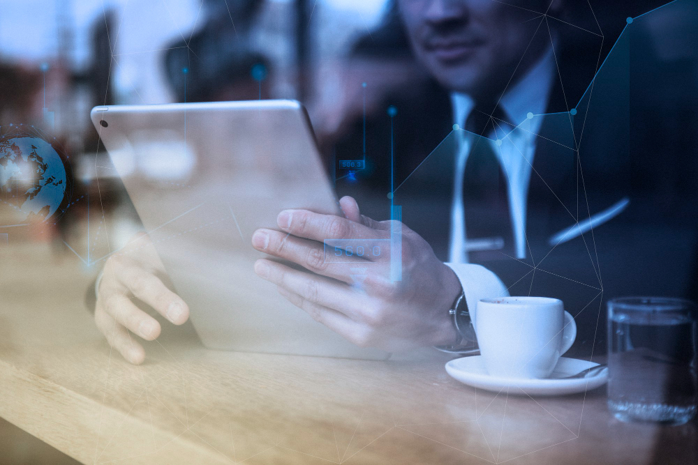/upl/businessman-working-on-tablet-in-cafe.jpg
