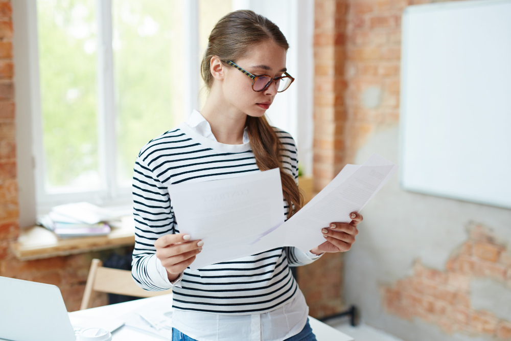 /upl/girl-reading-papers.jpg