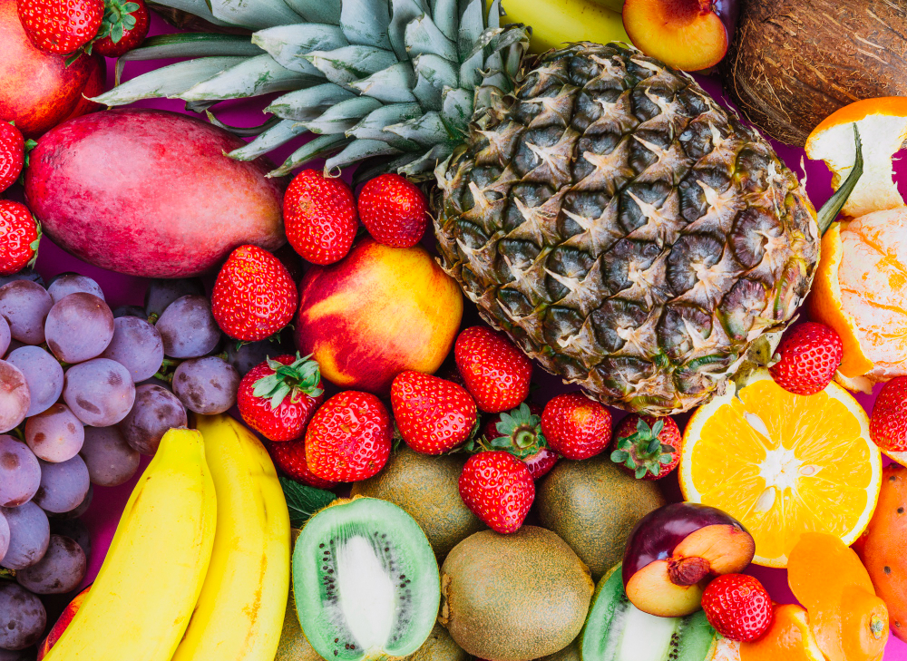 /upl/grapes-strawberries-pineapple-kiwi-apricot-banana-and-whole-pineapple.jpg