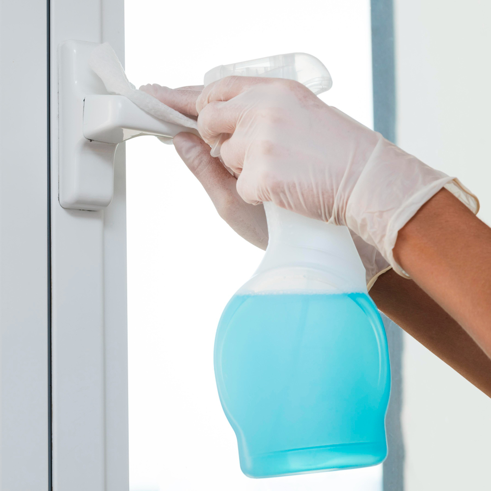 /upl/hands-with-gloves-disinfecting-window-handle.jpg