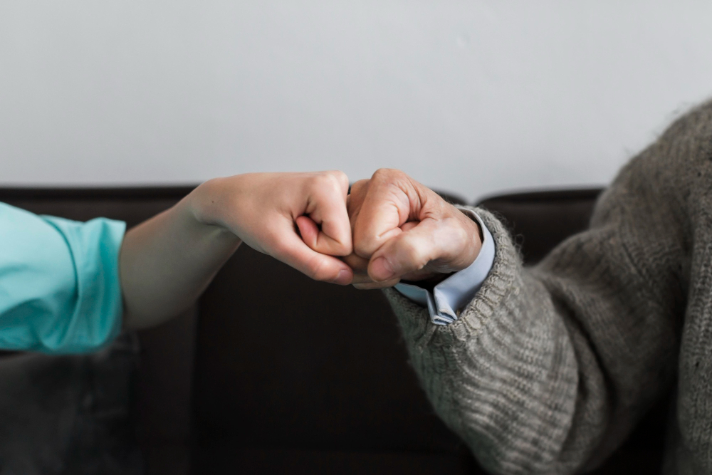 /upl/nurse-and-older-man-fist-bumping.jpg