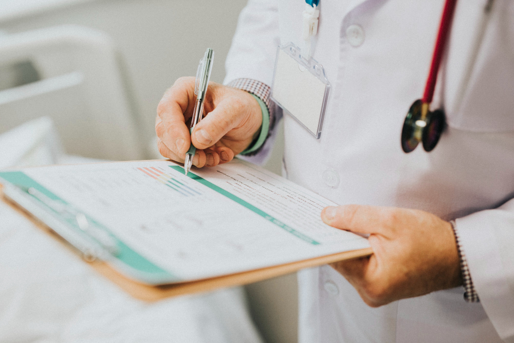 /upl/physician-noting-down-symptoms-of-a-patient.jpg