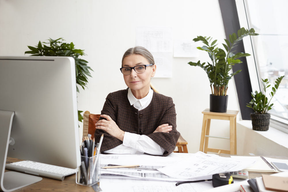 /upl/picture-of-beautiful-gray-haired-senior-caucasian-woman-architect-in-spectacles-smiling-and-keeping-arms-folded-having-rest-after-she-finished-drawing-of-huge-architectural-project.jpg