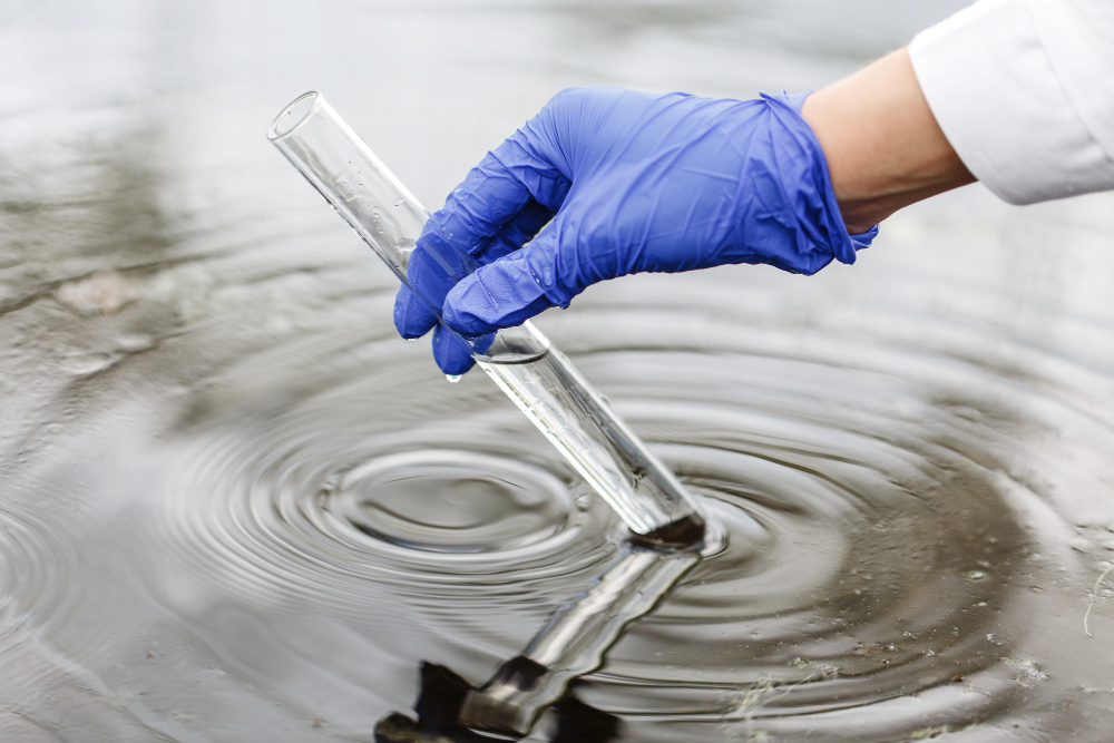 /upl/researcher-holds-a-test-tube-with-water-in-a-hand-in-blue-glove.jpg