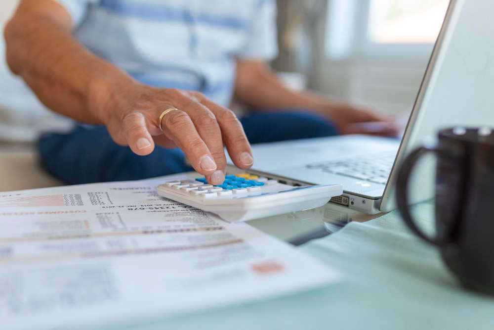 /upl/serious-elder-senior-greyhaired-grandpa-using-calculator-counting-bank-loan-payment-holding-papers-at-home-focused-mature-old-man-doing-paperwork-calculating-bills-managing-finances-sit-on-sofa.jpg